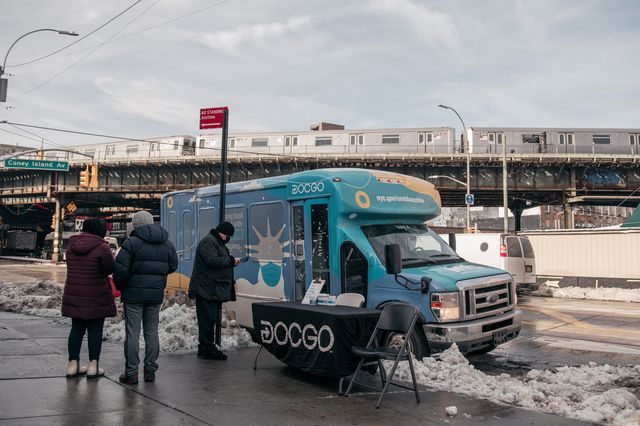 People wait to receive COVID-19 tests at a city-run van set up outside the Brighton Neighborhood Association office on Brighton Beach Avenue on February 2nd. The van also offers vaccines.